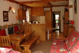 Location Le Corbier : Salle de séjour , confort et style montagne , meub